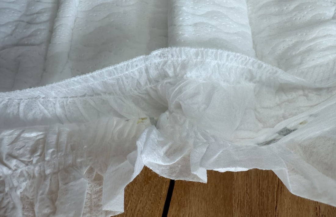 Leg cuff of a Little Puggles nappy, with the inner barrier cuff standing up from the leg edge